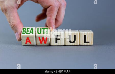 Beautiful or awful symbol. Businessman turns wooden cubes, changes the ...
