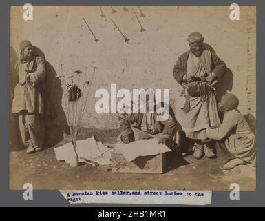 A Persian Kite Seller and Street Barber, One of 274 Vintage Photographs, Albumen silver photograph, late 19th-early 20th century, Qajar, Qajar Period, 6 1/8 x 8 3/16 in., 15.5 x 20.8 cm, commerce, craft, hobby, kite, leisure, pastime, recreation, sport, vendor Stock Photo