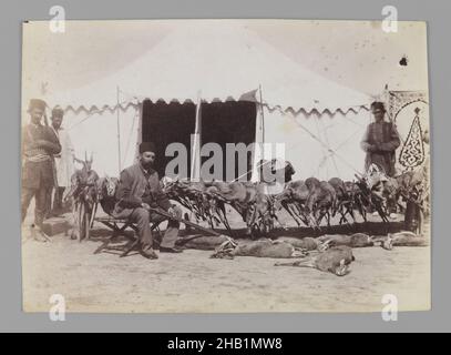 Prince Abdul Husayn Mirza, Farma Farmaian Seated before Hunted Gazelles, One of 274 Vintage Photographs, Albumen silver photograph, late 19th-early 20th century, Qajar, Qajar Period, 4 3/4 x 6 5/8 in., 12.1 x 16.9 cm, camping, cruel, dead, guns, man, pride, servants, sunshine Stock Photo