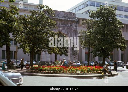 Flowers in small public park on roundabout in centre of spa town of Aix-les-Bains, Savoie, France, 1974 Stock Photo