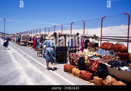 A line of souvenir craft stalls as people walk to the cruise ship terminal, Tangier, Morocco, north Africa 1999 Stock Photo