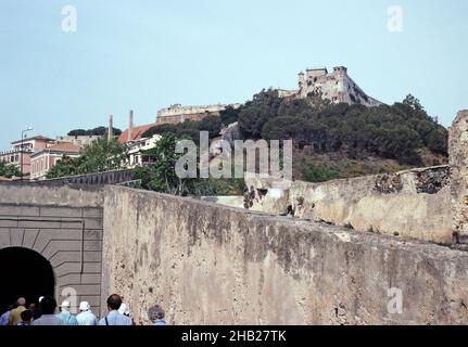 Tour group on Via Victor Hugo beneath historic fort Falcone, Portoferraio, island of Elba, Italy in 1999 Stock Photo