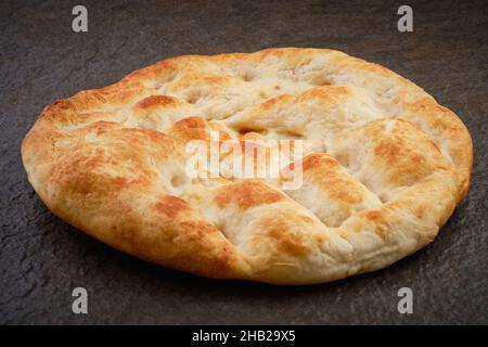 Pita bread on stone table surface Stock Photo