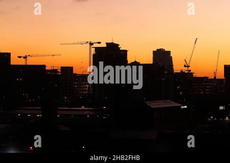Sunrise in Leeds City Centre. Building on the left is City Island & Bridgewater Place on the right. Stock Photo