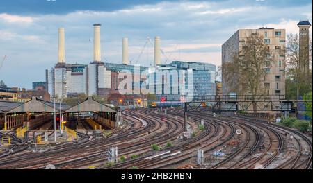 early evening view of the railway and maintenance depots with the former Battersea power Station behind. taken from Edbury Bridge, London, England, UK Stock Photo
