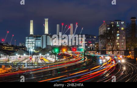 night time view of the railway and maintenance depots with the former Battersea power Station behind. taken from Edbury Bridge, London, England, UK Stock Photo