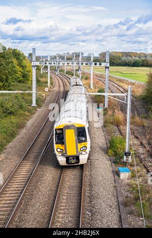 UK, England, Berkshire, Padworth Village, C2C Class 387 Local Passenger Train on the Main Line between Reading and Newbury near Aldermaston Stock Photo