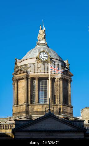 The dome of Liverpool Town Hall with Britannia statue and British flag Stock Photo