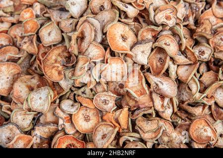 Dried Sliced Pears in Bulk. Dry fruit texture background. Stock Photo