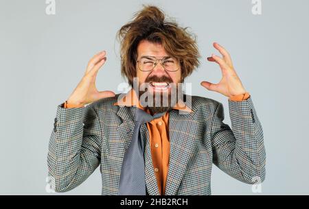 Angry Businessman in suit and glasses. Stressed business man shouting. Boss leader scream concept. Stock Photo