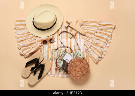 Beach accessories with passport, ticket and money on color background Stock Photo
