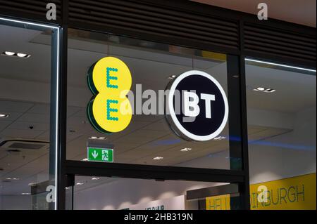 Edinburgh, Scotland- Nov 21, 2021:  The sign for the EE and BT Mobile store in Edinburgh. Stock Photo
