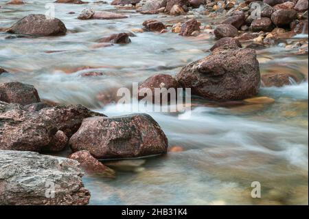 Glacial mountain river with waterfall in Autumn, Jasper National Park, Alberta, Canada Stock Photo