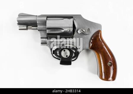 Close up of 38 caliber revolver hand gun with safety trigger lock. Stock Photo