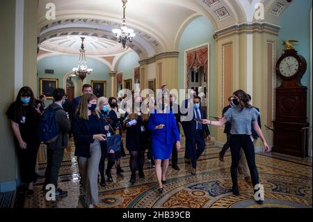 Washington DC, USA. 16th Dec, 2021. United States Senator Amy Klobuchar (Democrat of Minnesota) is surrounded by reporters as she arrives at the Senate chamber during a vote at the US Capitol in Washington, DC, Thursday, December 16, 2021. Credit: Rod Lamkey/CNP /MediaPunch Credit: MediaPunch Inc/Alamy Live News Stock Photo