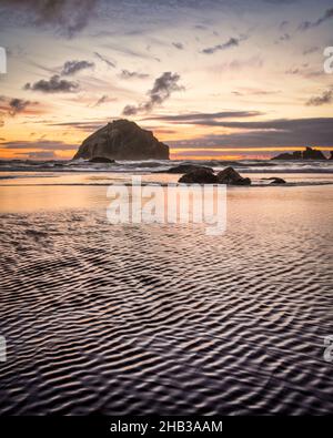 Face Rock Bandon Oregon with closeup of ripples in sand on beach Stock Photo