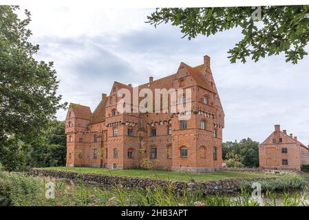 the famous red castle Borreby is a red brick-building surrounded by a moat in the southern Zealand, Denmark, August 10, 2021 Stock Photo