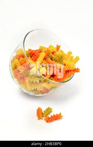 Colorful pasta in a glass on white background Stock Photo