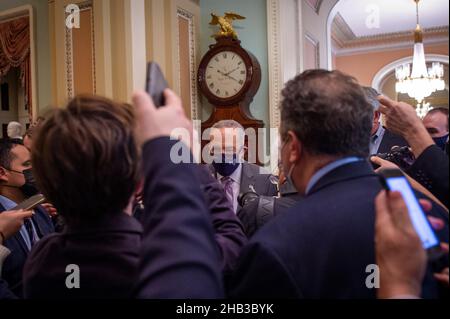 Washington, United States Of America. 16th Dec, 2021. United States Senate Majority Leader Chuck Schumer (Democrat of New York) is surrounded by reporters as he arrives at the Senate chamber during a vote at the US Capitol in Washington, DC, Thursday, December 16, 2021. Credit: Rod Lamkey/CNP/Sipa USA Credit: Sipa USA/Alamy Live News Stock Photo