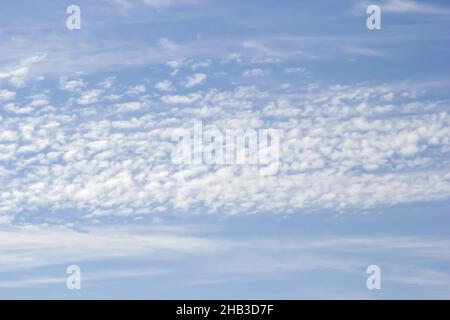 Background of white clouds on the background of soft blue sky. Stock Photo