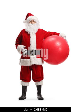 Full length portrait of santa claus holding a big fitness ball under his arm isolated on white background Stock Photo