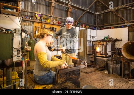 glass blowing lessons in the Harmony Glass Works, Harmony, California Stock Photo