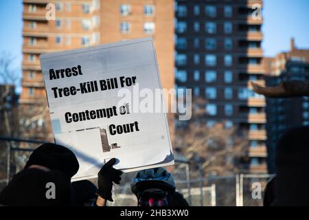 New York, USA. 12th Dec, 2021. A placard reads, ''Arrest tree kill bill for contempt of court.'' during the demonstration.Several park defenders are arrested as they protested after delivering a copy of the Temporary Restraining Order to police at the East River Park amphitheatre. (Credit Image: © Karla Cote/SOPA Images via ZUMA Press Wire) Stock Photo