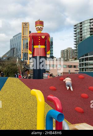 New Westminster Pier Park. World's Tallest Tin Soldier momument and playground for kids on a walkway by the Fraser river BC, Canada-December 5,2021. S Stock Photo