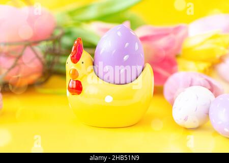 Easter greeting card with decorative chicken and painted eggs. Easter concept Stock Photo