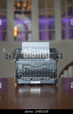 Old timey typewriter on wood table Stock Photo