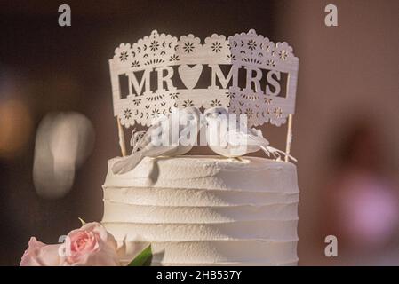 Beautiful  wedding cake with doves and me and mrs cake topper Stock Photo
