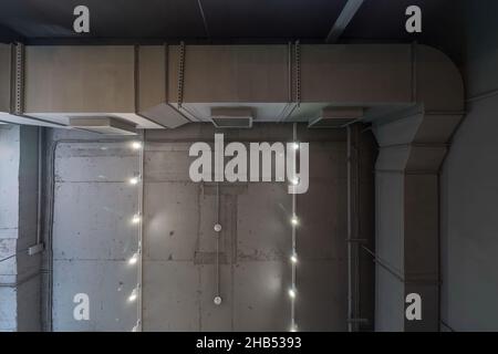 Abstract loft interior of concrete grey ceiling with air ventilation and security camera. Interior architecture and ceiling design of industrial loft Stock Photo