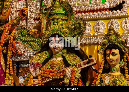 Statue of Goddess Saraswati holding a musical Instrument called Veena, clicked during Dussehra festival Kolkata, West Bengal, India. Stock Photo