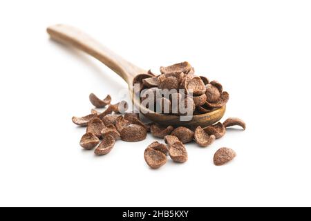 Sweet chocolate breakfast cereal flakes in wooden spoon isolated on white background. Stock Photo