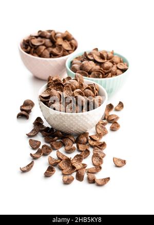 Sweet chocolate breakfast cereal flakes in bowl isolated on white background. Stock Photo