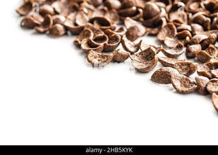 Sweet chocolate breakfast cereal flakes isolated on white background. Stock Photo
