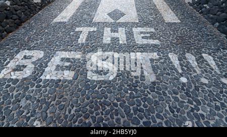 The Best!!! marked in white stones set into cobbled path, Perissa, Santorini, Greece Stock Photo
