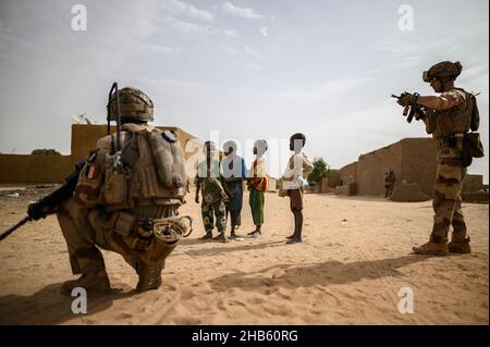 A platoon of the 3rd RIMA (naval infantry regiment), based in Vannes, Britany, and led by Lieutenant Geoffroy (27), patrols with the new 'Griffon' armored vehicle (deployed for the first time in a theater of operations) in the villages of Guintou, Bera and Seina, north of Gao, Mali on December 15, 2021. The patrol aims to contact with the population and villages chiefs, in particular, in order to ensure that the population is not threatened and to collect information on terrorists or bandits. France has been gradually retiring its troops from military bases in northern Mali and moving them to Stock Photo