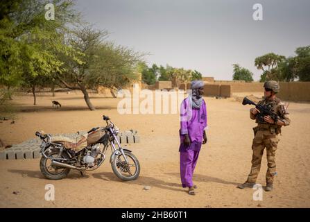 A platoon of the 3rd RIMA (naval infantry regiment), based in Vannes, Britany, and led by Lieutenant Geoffroy (27), patrols with the new 'Griffon' armored vehicle (deployed for the first time in a theater of operations) in the villages of Guintou, Bera and Seina, north of Gao, Mali on December 15, 2021. The patrol aims to contact with the population and villages chiefs, in particular, in order to ensure that the population is not threatened and to collect information on terrorists or bandits. France has been gradually retiring its troops from military bases in northern Mali and moving them to Stock Photo