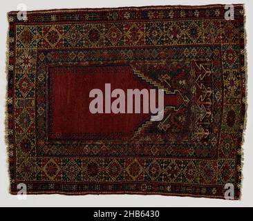Prayer rug with top panel, MUDJUR, Prayer rug with top panel, MUDJUR. Center field: brick red mihrab with pointed top with four-color stepped gable line. The swags are in bottle green, each with a large flower and a small white oil can. A narrow frieze runs above this with a white omega line between battlements in lilac, red and black. Edges: multiple. The middle and broadest is in yellow, on which tight squares are carved out on each of which is a star flower between four overcornered leaves; all with richly colored boxes, kaleidoscopically arranged. The inner hem is blue, with lozenges and Stock Photo