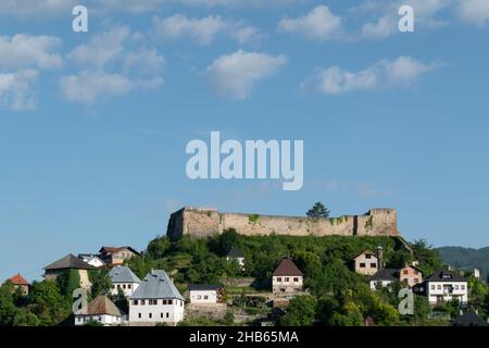 Medieval fortress on a hill surrounded by traditional houses in Jajce, Bosnia and Herzegovina Stock Photo