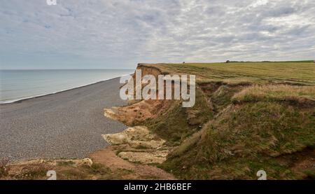 Pebble beach and cliff North Norfolk coast Stock Photo - Alamy
