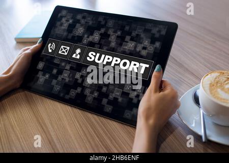 Technical support icons on screen. Call to help center. Internet and technology concept. Stock Photo