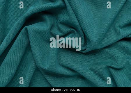 elegance green fabric texture with folds. wavy cloth Stock Photo