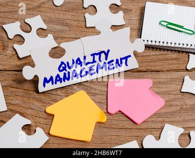 Writing displaying text Quality Management. Word Written on Maintain Excellence Level High Standard Product Services Building An Unfinished White Stock Photo