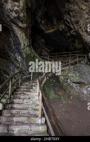 Stairs in the Predjama castle rock formation Stock Photo