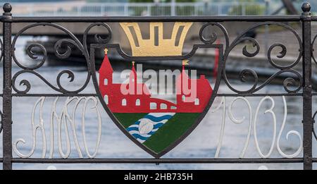 coat of arms in wrought iron with a church and the town hall on the bridge connecting the two parts of Skælskør, a town in Denmark, August 10, 2021 Stock Photo