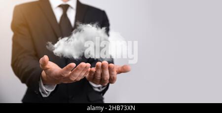 Hand holding icon cloud computing network and icon connection data information in hand. Cloud computing and technology concept Stock Photo