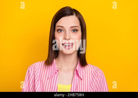 Photo of gorgeous tricky young lady tongue licking lips teeth look camera isolated on yellow color background Stock Photo