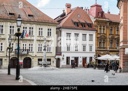 Ljubljana, Slovenia - 04 13 2018 people walking in the Streets of old Ljubljana during spring Stock Photo